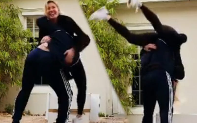 Andrade Surprises Charlotte Flair With Body Slam At Home