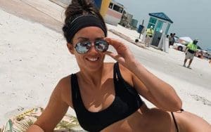 Chelsea Green Soaks In The Sun On A Public Beach