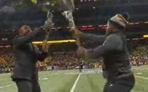 Big E Engages In Flag Battle Ahead Of Iowa vs Michigan Big Ten Title Game