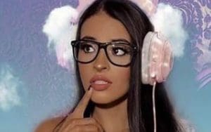 Zelina Vega Wants To Know Your Favorite Video Game In Stunning Low-Cut One-Piece Photo Drop