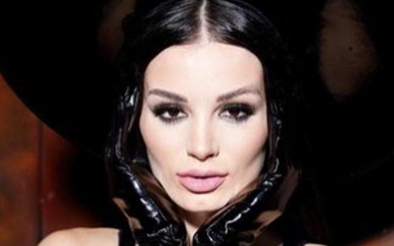 Paige Goes Full Witch Mode In Jaw-Dropping Black Corset Photo Drop