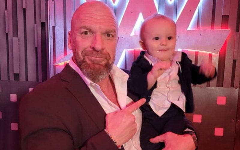 Triple H Takes Signature Point Photo With Johnny Gargano & Candice LeRae’s Son Quill