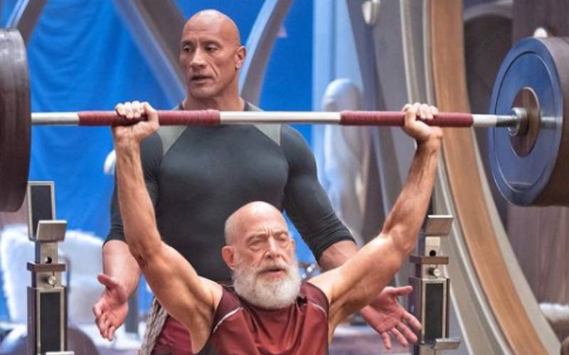 Dwayne Johnson Helps JK Simmons Bulk Up At North Pole For Upcoming ‘Red One’