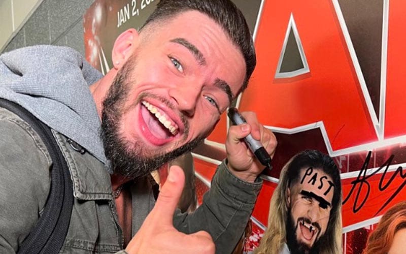 Austin Theory Defaces Seth Rollins Poster Before WWE Raw