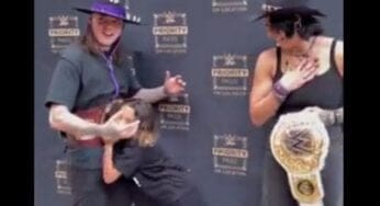 Young Fan Shoves Dominik Mysterio To Get Private Photo With Rhea Ripley At Meet & Greet