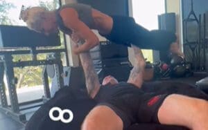 The Undertaker Bench Presses Michelle McCool In Impressive Video