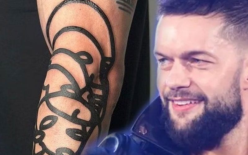 Finn Balor Flexes Symbolic Arm Tattoo