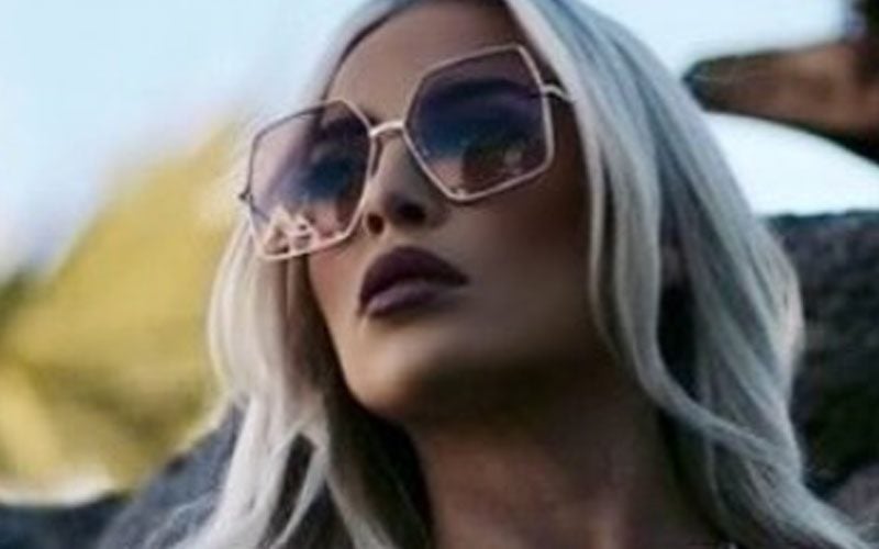 Ash by Elegance Radiates Confidence in Silver Bikini Photo