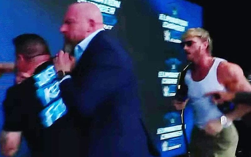 Kevin Owens & Logan Paul Brawl Break Out On Stage At WWE Elimination Chamber Press Event