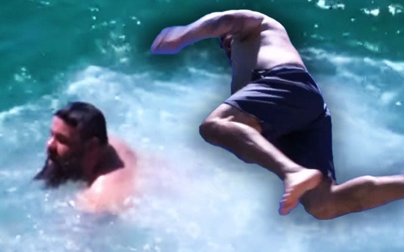 Kevin Owens Takes a Plunge with a Daring Leap into the Ocean in Perth, Australia