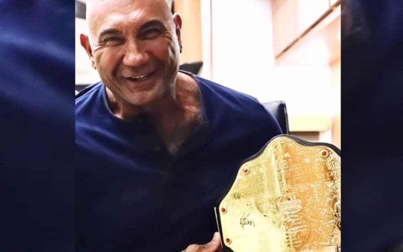 batista-gifts-custom-wwe-world-title-to-the-killers-game-director-16