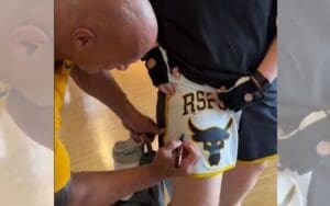 The Rock Signs Female Fan's Leg During Workout Interruption