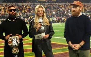 Jey Uso and Sami Zayn Present Custom WWE Title Belt at Big 12 Championship Game Jey Uso and Sami Zayn Present Custom WWE Title Belt at Big 12 Championship Game