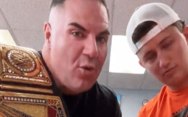 Truth Behind “Big Boom” AJ Holding Replica WWE Title Belt in Viral Ad
