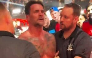 Footage Shows Security Restraining CM Punk After WWE Elimination Chamber Loss Footage Shows Security Restraining CM Punk After WWE Elimination Chamber Loss