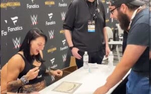 Rhea Ripley Signs Fan’s Adoption Certificate During WWE World Appearance